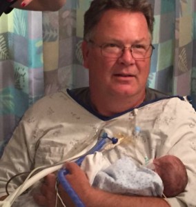 Kevin with his grandchild and namesake.